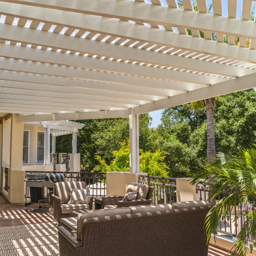 White Alumawood lattice cover over a furnished balcony